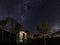 Wonderful starry night sky over a small shed