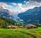 Wonderful summer view of Wengen village. Stunning mornig scene of Swiss Alps