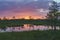 Wonderful sunset with colorful clouds over Suru Suursoo bog, Est