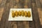 A wonderful tapa of homemade croquettes stuffed with mushrooms on a white porcelain tray