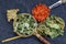 Wonderful Thai herbal tea with Dried pandan herb, indian marsh fleabane and safflower on spoons