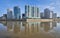 Wonderful view of the luxury residential complex of skyscrapers from the park of Victory, the houses are reflected in the water su