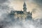 Wonderful view of the Neuschwanstein castle in the Bavaria Alps from the bridge lost in the fog with clouds