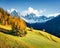 Wonderful view of Santa Maddalena village hills in front of the Geisler or Odle Dolomites Group. Colorful autumn scene of Dolomite