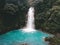 Wonderful waterfall flowing into Celeste river with turquoise water