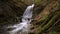 Wonderful waterfall on the mountain river Carpathians.