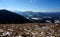 Wonderful winter panoramic: Woman enjoys the view into the wonderful mountain landscape