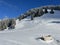 A wonderfully beautiful winter setting with a fresh snow cover in the Swiss Alps and above the Lake Walen or Lake Walenstadt