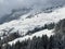 A wonderfully beautiful winter setting with a fresh snow cover in the Swiss Alps and above the Lake Walen or Lake Walenstadt