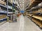 The wood aisle at Lowes home improvement store with stacks of lumber waiting for customers to purchase