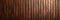 Wood background banner panorama long - Brown wooden acoustic panels wall texture, seamless pattern.