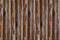 Wood background brown logs ribbed basis natural texture vertical parallel