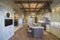 Wood Beamed Ceiling With Stools At Kitchen Island