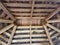 Wood beams in ceiling of shed with nests