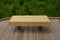 Wood bench or seat on boardwalk with green plants