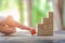 Wood block stacking as step stair and coins stacked, business growth to success.