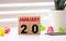 Wood blocks in box with date, day and month 20 January. Wooden blocks calendar