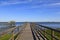 Wood Boardwalk Over the Water