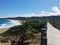 Wood boardwalk or path with trees at beach in Isabela, Puerto Rico