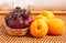 Wood bowl of cherries and four nectarines