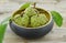 Wood-bowl with new harvest custard apple on background