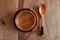 Wood Bowl, Plate and Spoon on Wood Slab Dinner Table