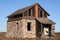 Wood and brick barn in field