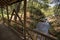 Wood bridge crossing a small river in Arvi park Medellin Colombia