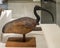 Wood and bronze sculpture of an Ibis bird on display in the NMEC in Cairo, Egypt.