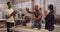 Wood, carpenter and a team celebrate in a workshop for target, sales and productivity. Men and a woman high five and