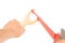 Wood catapult slingshot with hand on white background