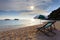 Wood chairs beach at sea side and sun set