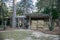 Wood chicken coop on a rural home property with chickens inside