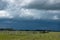 Wood Corral with approaching storm clouds, Saskatchewan, Canada.