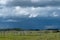 Wood Corral with approaching storm clouds, Saskatchewan, Canada.