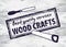 Wood craft stamp on wooden background. Woodworks professional service. Grange print stamp and chisel and saw.