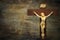 Wood crucifix on a grunge wood background with the body of Chris