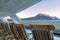 Wood deck lounge chairs at sunrise, stern verandah of cruise ship, Skagway, AK.