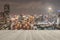 Wood deck in sepia tone with blurred abstract background of night light of Bangkok cityscape