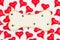 Wood dog bone with paw print with red hearts on white fabric background
