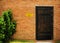 Wood door on brick wall