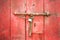 Wood door with lock chain red color old rustic texture