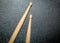 Wood Drumsticks in black texture background