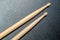 Wood Drumsticks in black texture background