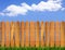 Wood fence and blue sky horizon