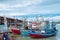 Wood fishing boats moored at wharf