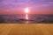 Wood floor on sea with purple sunset Burning Skie beautiful natural tropical sea