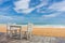 wood floor and seaside table with beach and sea background.