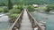 Wood foot bridge on river Serio