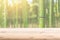 Wood foreground with blur bamboo wood forest background